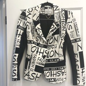 Fashionable fun black and white two button blazer.